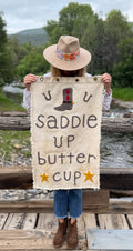 One of a Kind Banner: "saddle up buttercup"